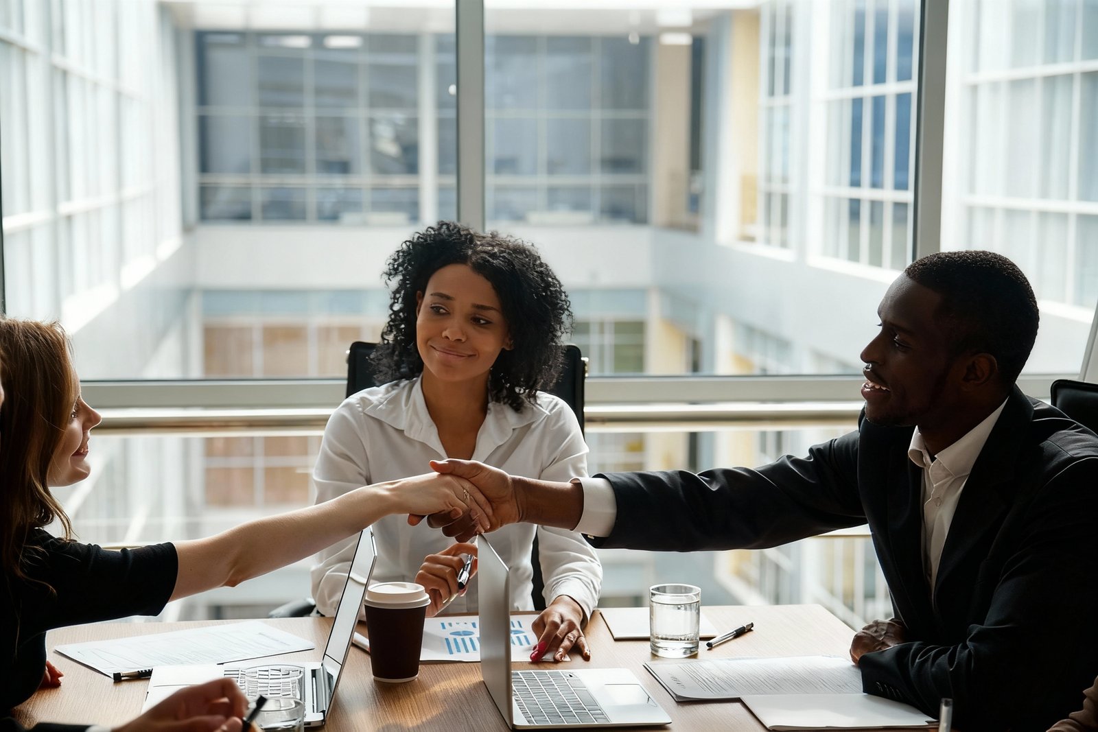 Real estate agent reviewing home valuation documents with clients.
